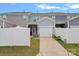Rear exterior view showing garage and private patio at 208 Waterlynn Ridge Rd # B, Mooresville, NC 28117