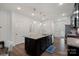 Modern kitchen with island, granite countertops, and stainless steel appliances at 208 Waterlynn Ridge Rd # B, Mooresville, NC 28117