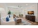 Cozy living room with light sofa, ottoman, and large windows at 208 Waterlynn Ridge Rd # B, Mooresville, NC 28117