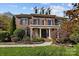 Brick house with a two-story facade, balcony, and landscaping at 26243 Camden Woods Dr, Indian Land, SC 29707