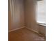 Cozy bedroom with neutral walls and carpet flooring at 441 Holly Cir, Mount Holly, NC 28120