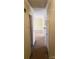 A long hallway with carpeted floors and doors leading to other rooms at 441 Holly Cir, Mount Holly, NC 28120