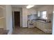 Efficient kitchen with white cabinets and vinyl flooring at 441 Holly Cir, Mount Holly, NC 28120