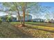 Large backyard with trees and a two-story house at 1110 Archer Farm Dr, Salisbury, NC 28144