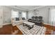 Living room with hardwood floors, comfy seating and a coffee table at 137 Rose Tree Ln, Fort Mill, SC 29715