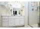Bathroom with white vanity, large mirror, and glass shower at 1846 Colin Creek Ln, Charlotte, NC 28214