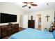Main bedroom with large TV and ensuite bathroom access at 1846 Colin Creek Ln, Charlotte, NC 28214
