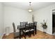 Dining area with a black table and four chairs at 1846 Colin Creek Ln, Charlotte, NC 28214