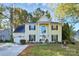 Two-story house with a yellow exterior, landscaping, and a two-car garage at 1846 Colin Creek Ln, Charlotte, NC 28214