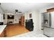 Kitchen with stainless steel appliances and view into living room at 1846 Colin Creek Ln, Charlotte, NC 28214