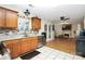 Open kitchen features stainless steel appliances and view to living room at 1846 Colin Creek Ln, Charlotte, NC 28214