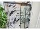 Modern shower with black frame glass door and marble tile at 1846 Colin Creek Ln, Charlotte, NC 28214