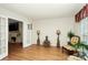 Sitting room with hardwood floors, access to living room, and plenty of light at 1846 Colin Creek Ln, Charlotte, NC 28214