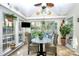 Bright sunroom with plants, wicker chairs, and a table, offering ample natural light at 1846 Colin Creek Ln, Charlotte, NC 28214