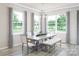 Bright dining room with large windows and wooden table at 2131 Endeavor Run, Charlotte, NC 28269