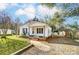 White Ranch style home with front porch, carport, and detached shed at 305 Belton Ave, Mount Holly, NC 28120