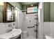 Bathroom with shower, sink, and white tile at 307 Kings Mountain St, Clover, SC 29710