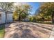 Spacious backyard with stamped concrete patio, shed, and playset at 307 Kings Mountain St, Clover, SC 29710