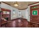Formal dining room with hardwood floors, built-in shelving, and stained glass at 307 Kings Mountain St, Clover, SC 29710