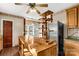 Kitchen features an island, stainless steel refrigerator, and wood cabinets at 307 Kings Mountain St, Clover, SC 29710