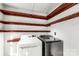 Laundry room with washer, dryer and ample shelving at 307 Kings Mountain St, Clover, SC 29710