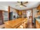 Kitchen boasts an island, stainless steel appliances, and wood cabinets at 307 Kings Mountain St, Clover, SC 29710