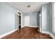 Simple bedroom with hardwood floors and open doorway at 307 Kings Mountain St, Clover, SC 29710