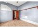 Small bedroom with hardwood floors and exposed walls at 307 Kings Mountain St, Clover, SC 29710