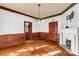 Living room with hardwood floors, decorative fireplace, and built-in shelving at 307 Kings Mountain St, Clover, SC 29710