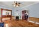 Living room with hardwood floors, fireplace, and pocket doors at 307 Kings Mountain St, Clover, SC 29710
