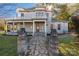 Two-story house with stone pillars and a walkway leading to the entrance at 307 Kings Mountain St, Clover, SC 29710