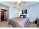 Spacious bedroom with a comfortable bed and access to another room at 401 N Church St # 406, Charlotte, NC 28202