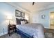 Spacious bedroom with a comfortable bed and plenty of natural light at 401 N Church St # 406, Charlotte, NC 28202