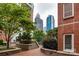 Brick building with courtyard showcasing city skyline view at 401 N Church St # 406, Charlotte, NC 28202