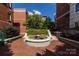 Landscaped courtyard with fountain and brick pavement at 401 N Church St # 406, Charlotte, NC 28202