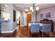 Elegant dining room features a glass table, hardwood floors, and stylish decor at 401 N Church St # 406, Charlotte, NC 28202