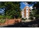 Building exterior showcasing landscaping and brick wall at 401 N Church St # 406, Charlotte, NC 28202
