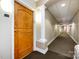 Building hallway with wood door and white columns at 401 N Church St # 406, Charlotte, NC 28202