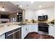 Modern kitchen with stainless steel appliances and white cabinets at 401 N Church St # 406, Charlotte, NC 28202