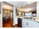 Modern kitchen with island, stainless steel appliances and white cabinets at 401 N Church St # 406, Charlotte, NC 28202