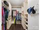 Large walk-in closet with custom built-ins and ample storage at 8225 Ballymore Ct, Huntersville, NC 28078