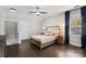 Bright bedroom with hardwood floors and ceiling fan at 8225 Ballymore Ct, Huntersville, NC 28078