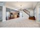 Open concept dining area with kitchen and staircase view at 9035 Fairbridge Rd, Charlotte, NC 28277