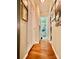 Bright hallway with wood flooring and access to bedrooms and bathroom at 940 Devil Track Rd, Taylorsville, NC 28681