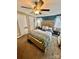 Main bedroom with ceiling fan and built-in shelving at 940 Devil Track Rd, Taylorsville, NC 28681