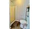 Small bathroom with shower, toilet and a small shelf at 940 Devil Track Rd, Taylorsville, NC 28681