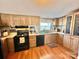 Kitchen boasts wood cabinets, ample counter space, and modern appliances at 940 Devil Track Rd, Taylorsville, NC 28681