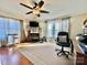 Living room featuring a fireplace, large windows, and a cozy atmosphere at 940 Devil Track Rd, Taylorsville, NC 28681