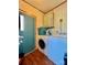 Laundry room with washer, dryer, and extra storage at 940 Devil Track Rd, Taylorsville, NC 28681