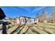 Single-story home with a spacious yard and mature trees at 940 Devil Track Rd, Taylorsville, NC 28681